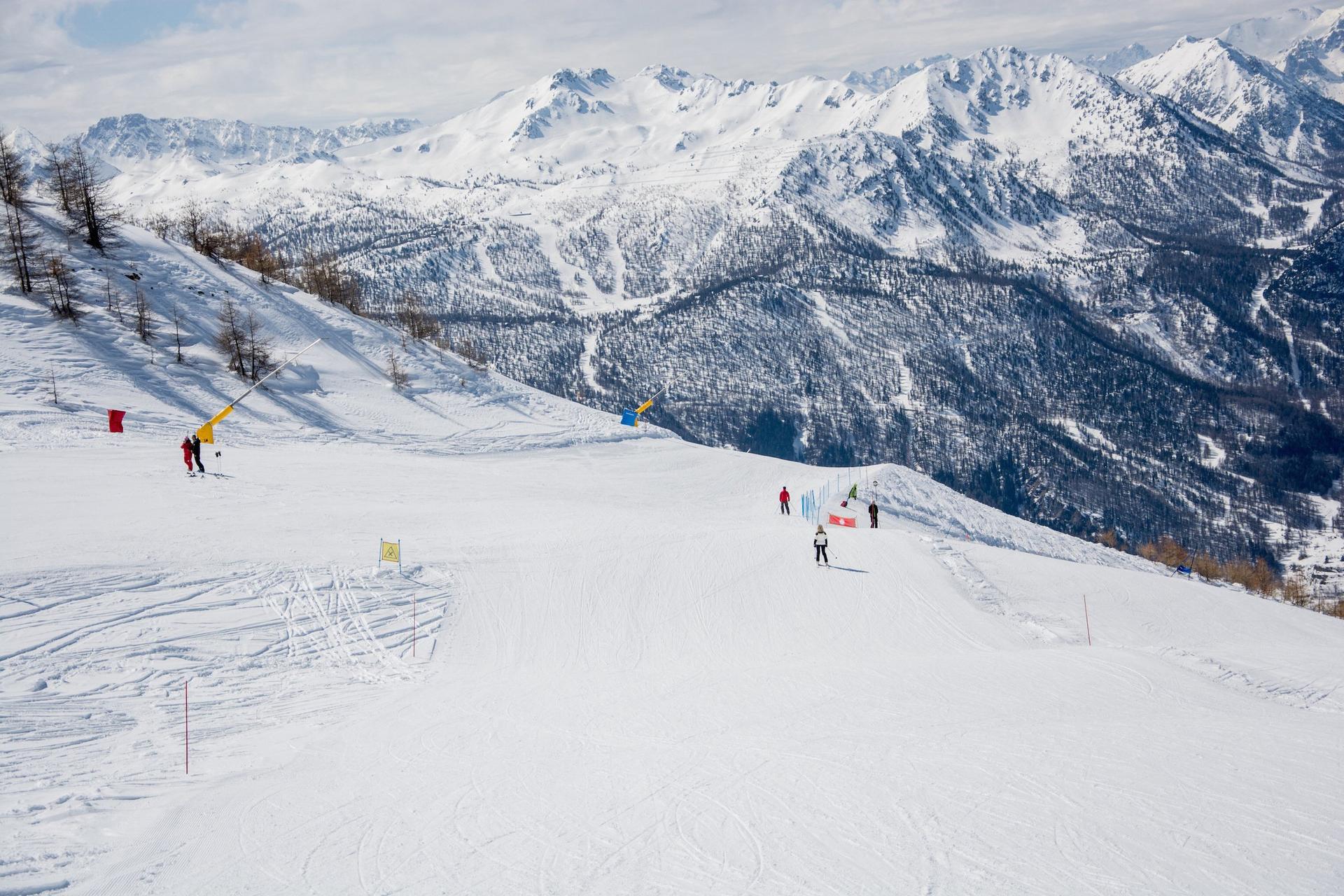 Skiers on a piste in Sestriere