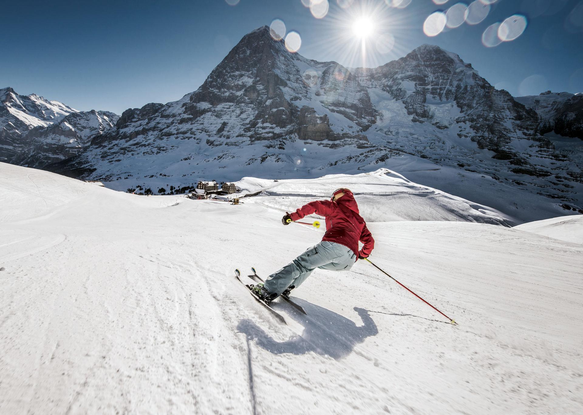 Skier carving down ski slope in Wengen Switzerland