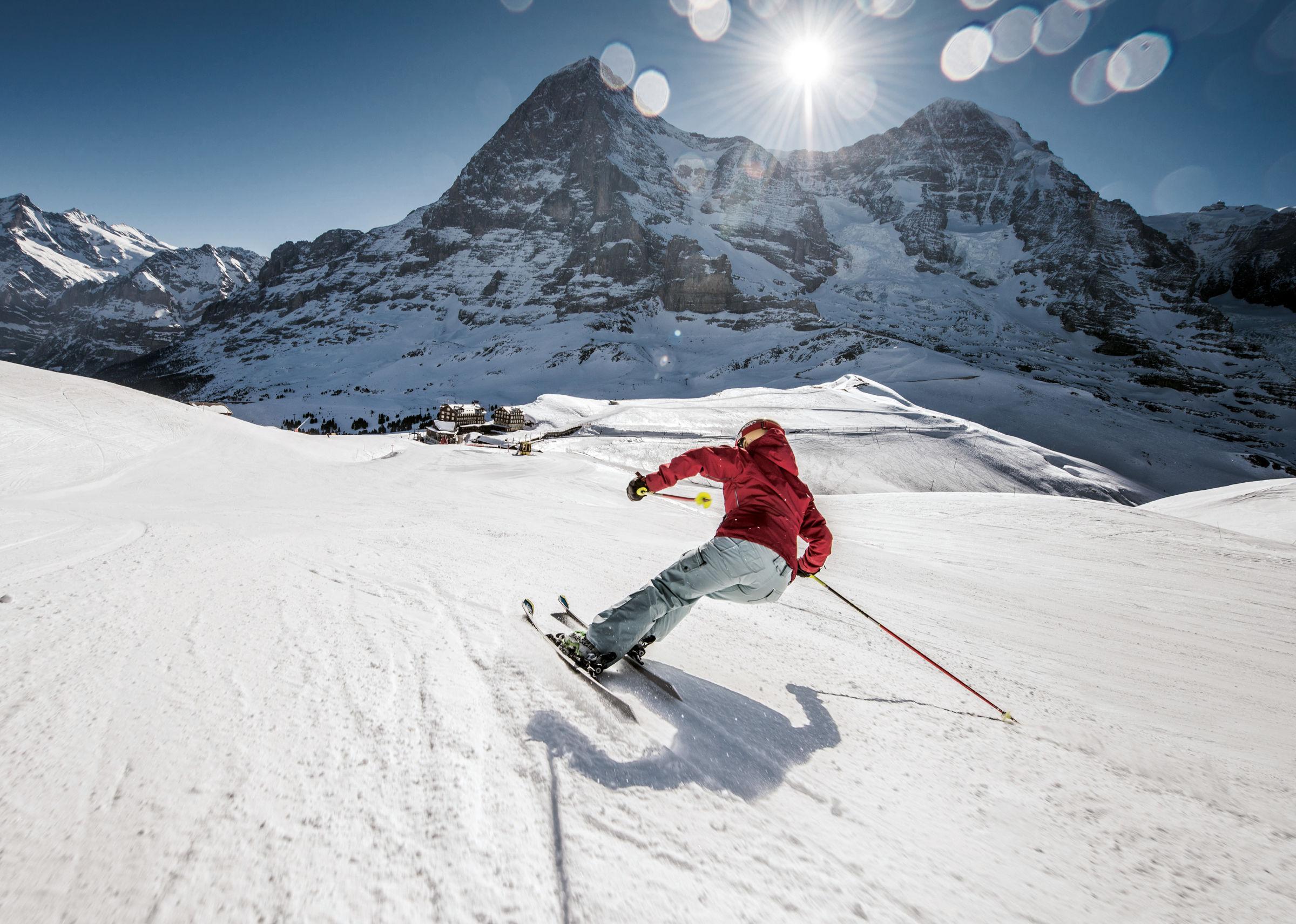 Skier carving down ski slope in Wengen Switzerland