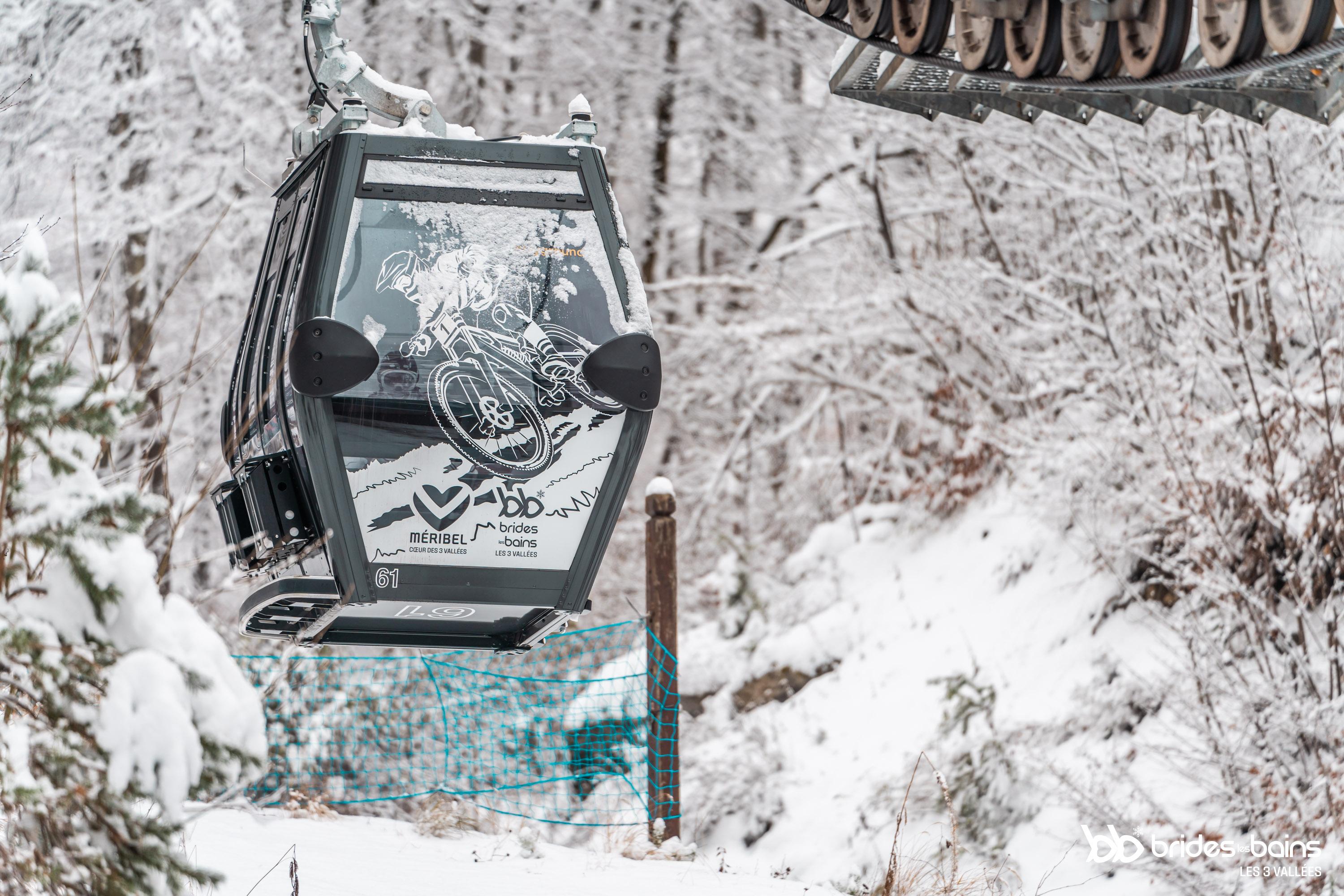 Gondola that take you from Brides les Bains to Meribel with a snow covered backdrop